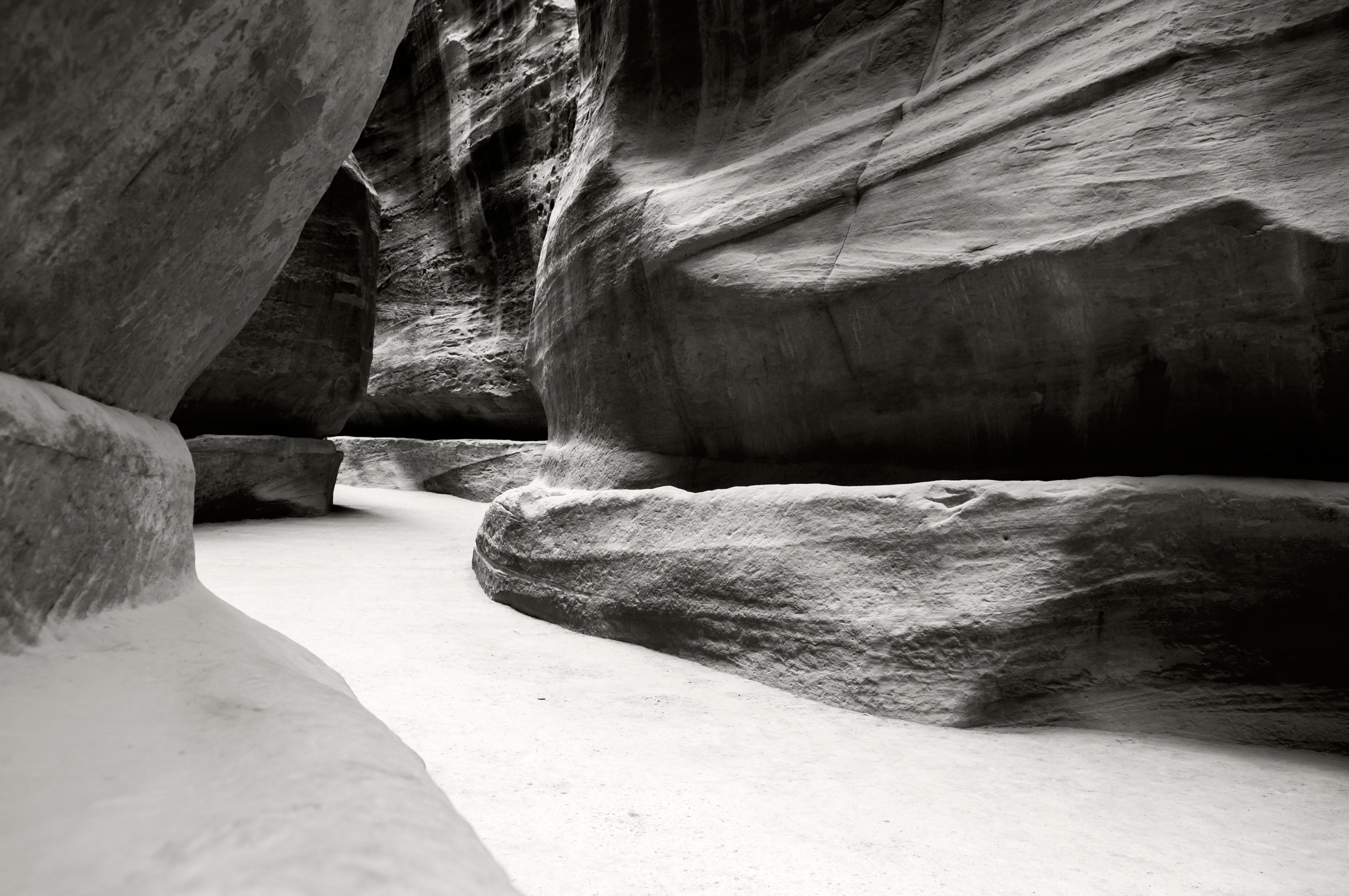 Black and white photograph of the Siq in Petra Jordan